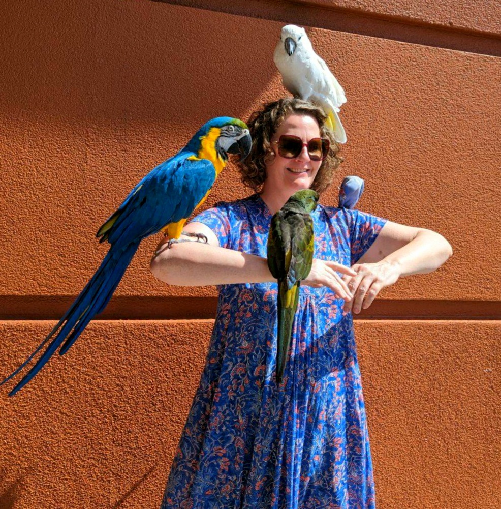 Isis Latham with parrots